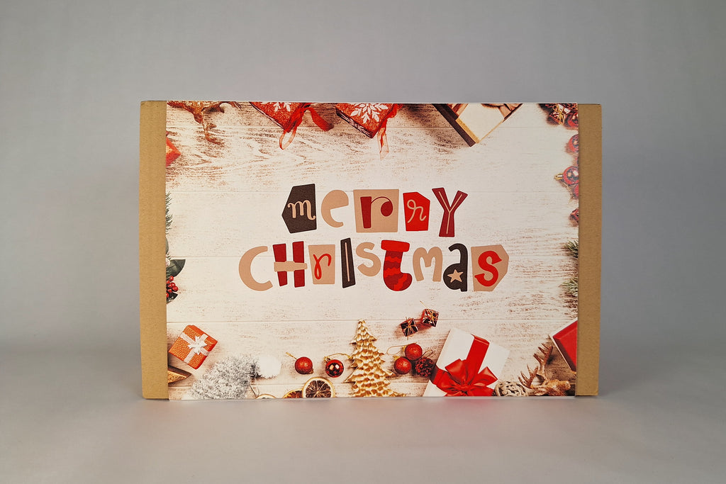 Scatola regalo natalizia elegante per dopocena con tè e cioccolato